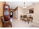 Elegant dining area with a glass-top table and ornate chairs at 250 White Marsh Cir, Orlando, FL 32824