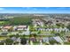 Aerial view showing home's location in a residential neighborhood near a lake at 250 White Marsh Cir, Orlando, FL 32824