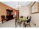 Elegant dining room featuring a glass table and hardwood floors at 250 White Marsh Cir, Orlando, FL 32824