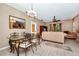 Combined dining and living room with seating and a glass-top table at 250 White Marsh Cir, Orlando, FL 32824
