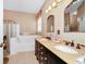 Bathroom boasts double sinks, a soaking tub, and a separate shower at 250 White Marsh Cir, Orlando, FL 32824