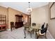 Bright dining room featuring a glass-top table and elegant chairs at 250 White Marsh Cir, Orlando, FL 32824