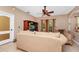 Comfortable living room with a beige sofa and large-screen TV at 250 White Marsh Cir, Orlando, FL 32824