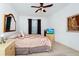 Spacious bedroom with tiled floors and ceiling fan at 250 White Marsh Cir, Orlando, FL 32824