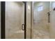 Large walk-in shower with tile surround and built-in bench at 25602 Grandview Pointe, Sorrento, FL 32776