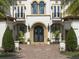 Impressive double front doors with wrought iron detailing at 25602 Grandview Pointe, Sorrento, FL 32776