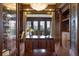 Luxurious home office features built-in shelves and large windows at 25602 Grandview Pointe, Sorrento, FL 32776