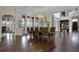 Formal dining room with hardwood floors, large windows, and a chandelier at 25602 Grandview Pointe, Sorrento, FL 32776