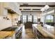 Bright kitchen with granite countertops, stainless steel appliances and custom backsplash at 25602 Grandview Pointe, Sorrento, FL 32776