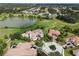 Luxury estate home in an upscale community with a circular driveway and lake view at 25602 Grandview Pointe, Sorrento, FL 32776