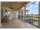Screened lanai with a table and chairs, offering scenic views at 25602 Grandview Pointe, Sorrento, FL 32776
