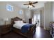 Elegant bedroom with a king-size bed, hardwood floors, and access to a private balcony at 25602 Grandview Pointe, Sorrento, FL 32776