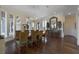 Formal dining room with hardwood floors, large windows, and a sideboard at 25602 Grandview Pointe, Sorrento, FL 32776