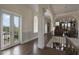 Elegant hallway with hardwood floors and French doors to balcony at 25602 Grandview Pointe, Sorrento, FL 32776