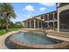 Expansive pool with a waterfall feature and lush landscaping at 25602 Grandview Pointe, Sorrento, FL 32776