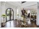 Two-story foyer with hardwood floors and elegant décor at 25602 Grandview Pointe, Sorrento, FL 32776