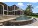 Stunning curved pool with waterfall and patio area at 25602 Grandview Pointe, Sorrento, FL 32776