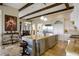 Open kitchen with granite island, stainless steel appliances, and hardwood floors at 25602 Grandview Pointe, Sorrento, FL 32776