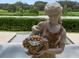 Ornate statue of a maiden holding a basket of grapes at 25602 Grandview Pointe, Sorrento, FL 32776