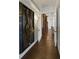 Elegant hallway with hardwood floors and unique wall art at 25602 Grandview Pointe, Sorrento, FL 32776