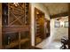 Custom wine cellar with wooden shelving and a wine refrigerator at 25602 Grandview Pointe, Sorrento, FL 32776