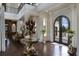 Spacious entryway with a grand staircase and high ceilings at 25602 Grandview Pointe, Sorrento, FL 32776