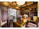 Spacious home office with wood detailing and access to another room at 25602 Grandview Pointe, Sorrento, FL 32776
