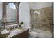 Bathroom with single vanity, bathtub, and glass shower enclosure at 25602 Grandview Pointe, Sorrento, FL 32776