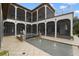 Luxury pool and spa area with cascading waterfalls and a courtyard setting at 25602 Grandview Pointe, Sorrento, FL 32776