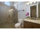 Modern bathroom with a large walk-in shower and granite vanity at 25602 Grandview Pointe, Sorrento, FL 32776