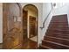 Custom wine cellar with wooden shelving and arched doorway at 25602 Grandview Pointe, Sorrento, FL 32776