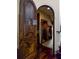 Custom wine cellar with wooden shelving and arched doorway at 25602 Grandview Pointe, Sorrento, FL 32776