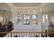 Bright hallway with large windows offering scenic views at 25602 Grandview Pointe, Sorrento, FL 32776