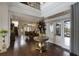 Elegant two-story entry with hardwood floors, chandelier, and view to formal dining room at 25602 Grandview Pointe, Sorrento, FL 32776