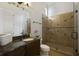Bathroom with granite countertops, a large shower, and a toilet at 25602 Grandview Pointe, Sorrento, FL 32776