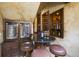 Custom wine cellar bar with granite countertop and wine cooler at 25602 Grandview Pointe, Sorrento, FL 32776