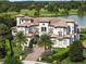Luxury home situated on a spacious lot with a lake view at 25602 Grandview Pointe, Sorrento, FL 32776