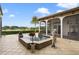 Relaxing pool and spa area with lake view, featuring a stone deck at 25602 Grandview Pointe, Sorrento, FL 32776
