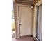 Exterior storage room with a white door and light fixture at 1916 Lake Atriums Cir # 25, Orlando, FL 32839