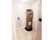 Small laundry room with a water heater and floor drain at 1916 Lake Atriums Cir # 25, Orlando, FL 32839