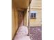 Condo building exterior with a brown door and small window at 1916 Lake Atriums Cir # 25, Orlando, FL 32839