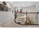 Elegant upstairs hall with a curved staircase and chandelier at 1463 Dunbrooke Loop, Longwood, FL 32779