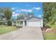 Single story home with gray siding and white trim, attached garage at 2524 Creekview Cir, Oviedo, FL 32765