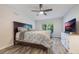 Main bedroom with wood-look floors and a view of the backyard at 2524 Creekview Cir, Oviedo, FL 32765