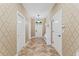 Bright entryway with tiled floor and built-in bench at 1414 Thunderbird Rd, Davenport, FL 33896