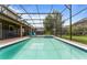 Screened pool and spa with lounge chairs and patio area at 1414 Thunderbird Rd, Davenport, FL 33896
