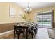 Bright dining room with pool view and a large table at 1414 Thunderbird Rd, Davenport, FL 33896