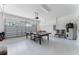 Finished garage with ping pong table and extra storage space at 1414 Thunderbird Rd, Davenport, FL 33896