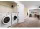 Convenient laundry room with washer and dryer at 1414 Thunderbird Rd, Davenport, FL 33896