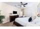Main bedroom with king-size bed, dresser, and TV at 1414 Thunderbird Rd, Davenport, FL 33896
